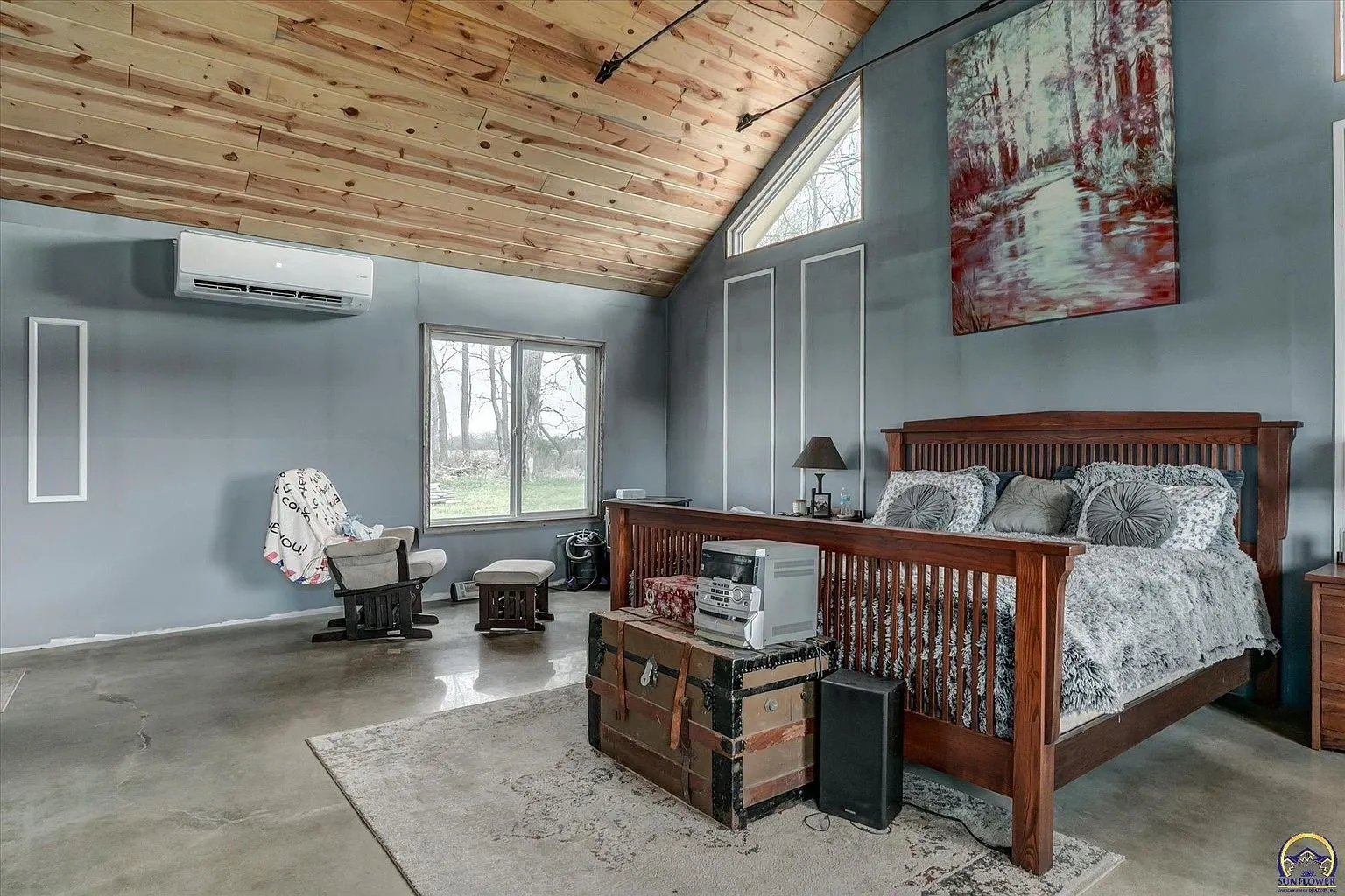 The primary bedroom with the mini-split and the window