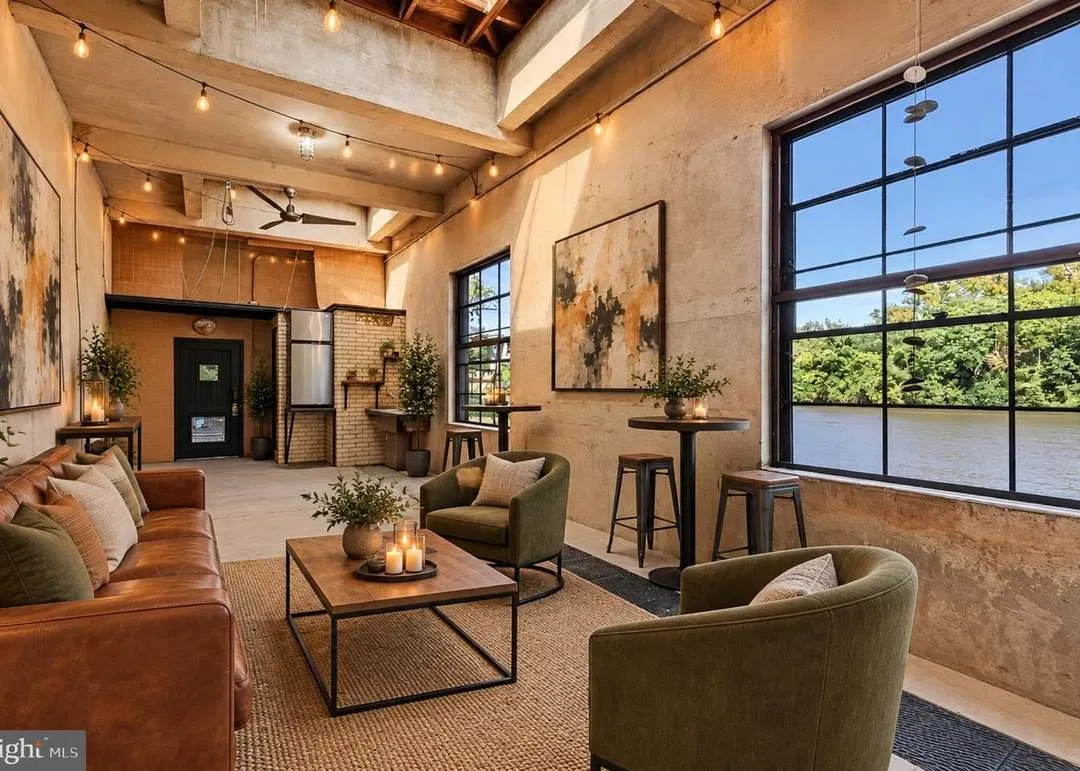 A second view of The River Room's lounge seating and tall windows