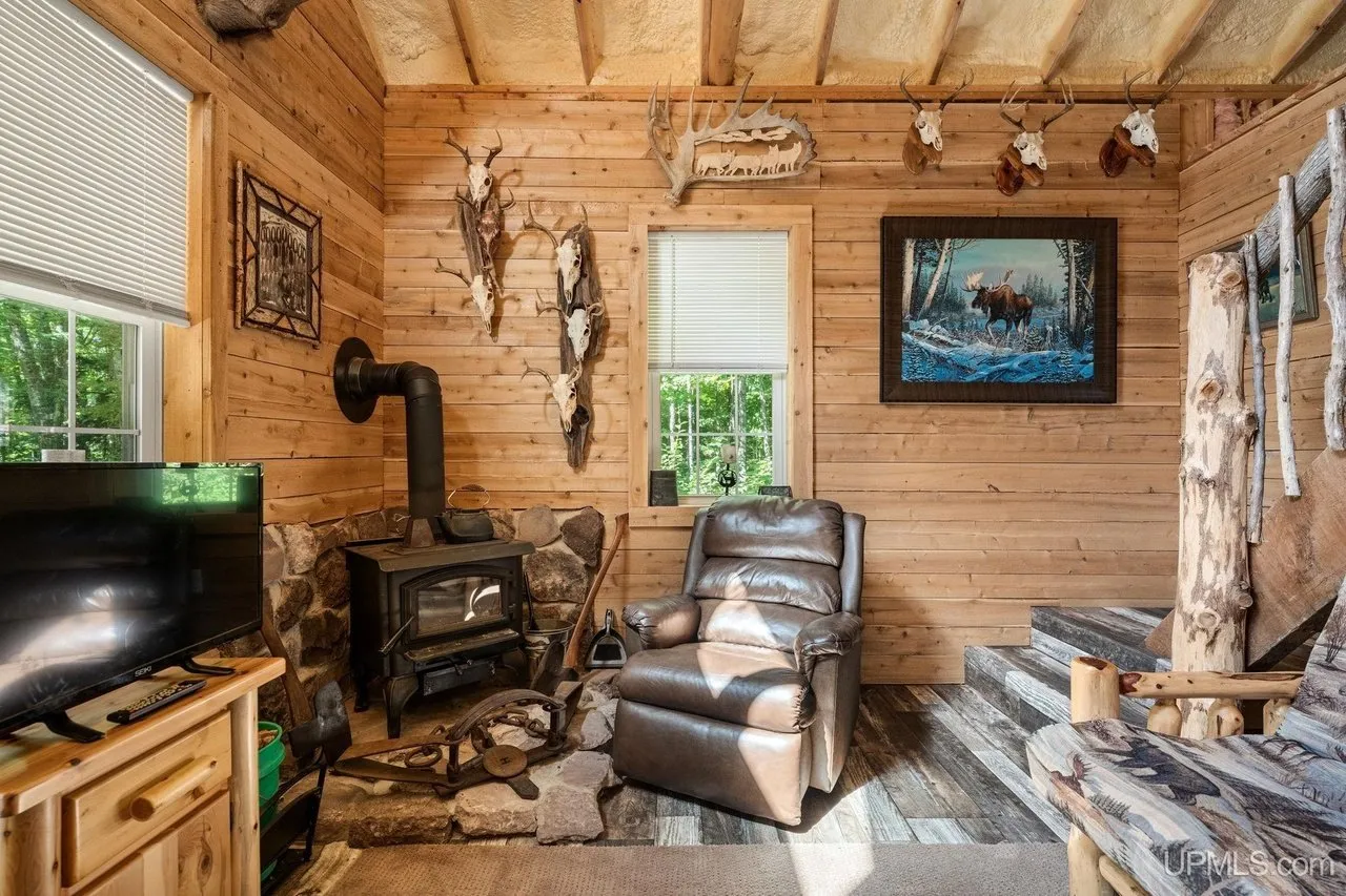 The wood stove and recliners in the main room