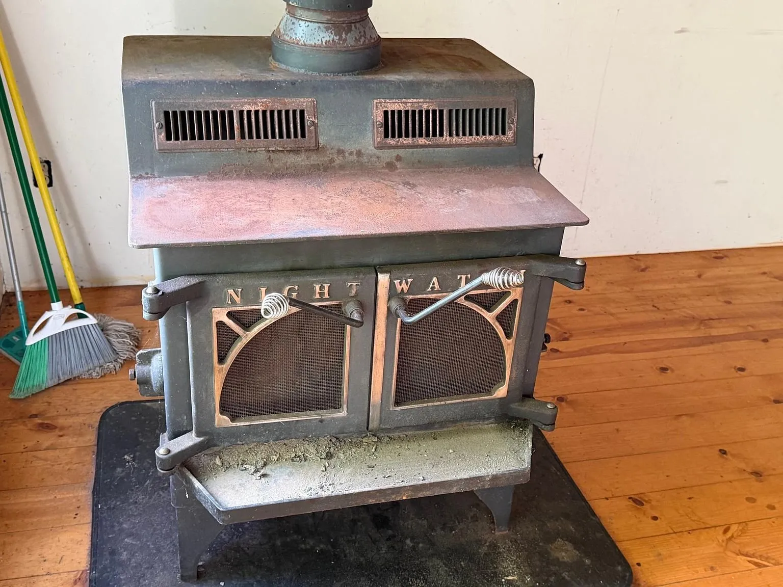 The wood stove on the floor of the main room