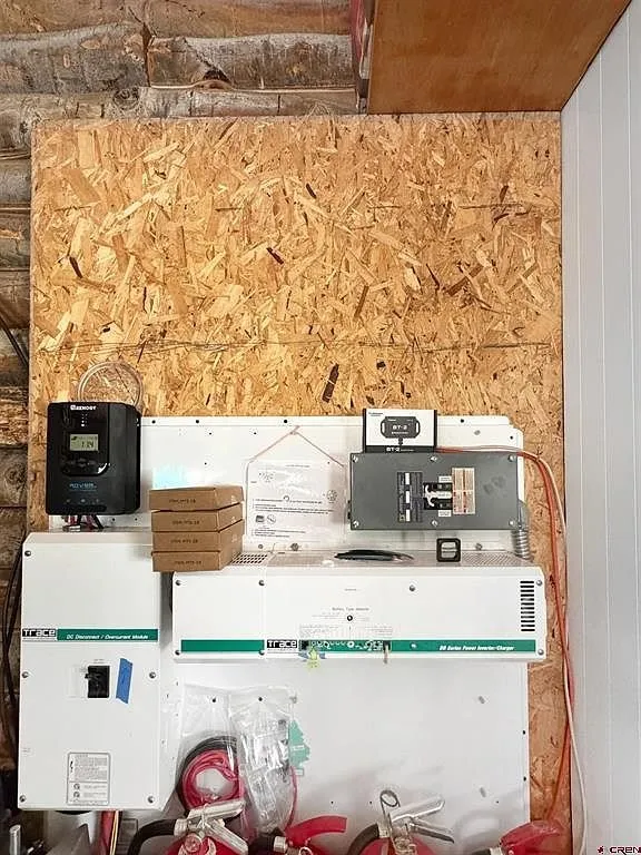 The solar charge controller and inverter on the wall