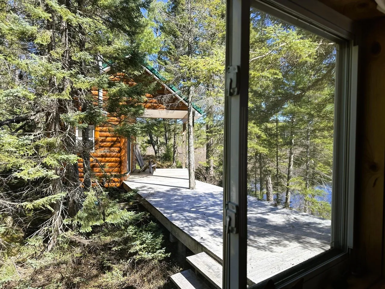 The sliding glass doors and windows facing the river