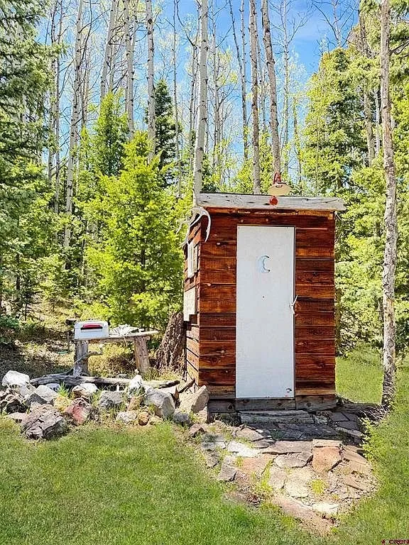 The outhouse in the aspens