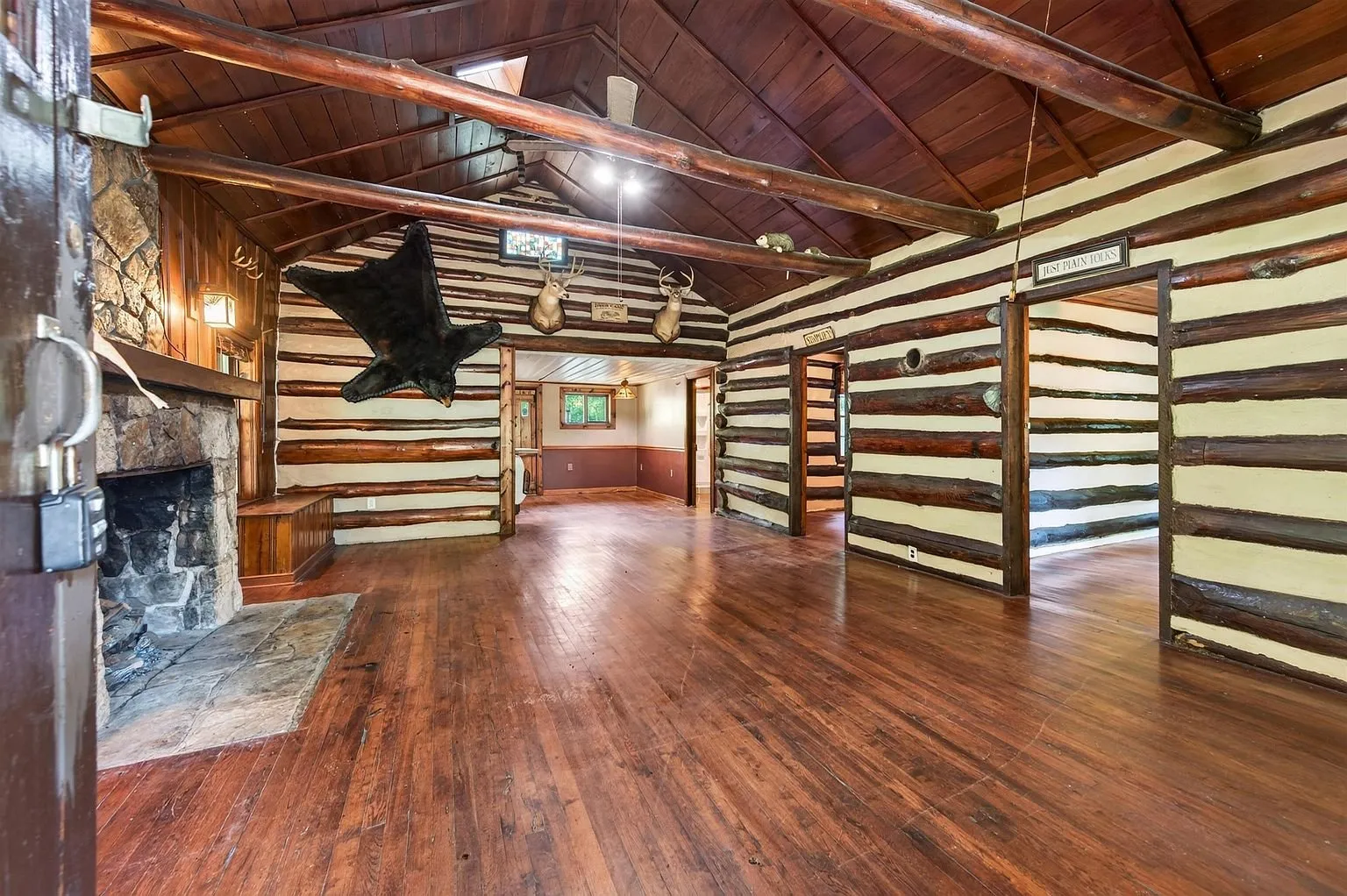 The family room with the stone fireplace