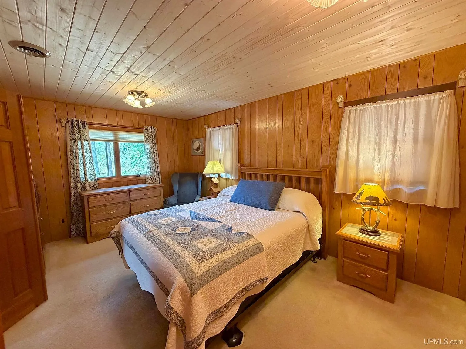 The first bedroom with a bed and nightstands