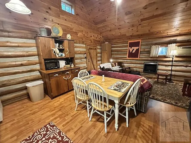 The dining area and hutch along the log wall