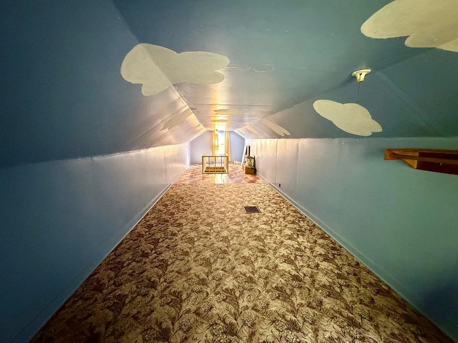 The long upstairs room with the painted sky ceiling