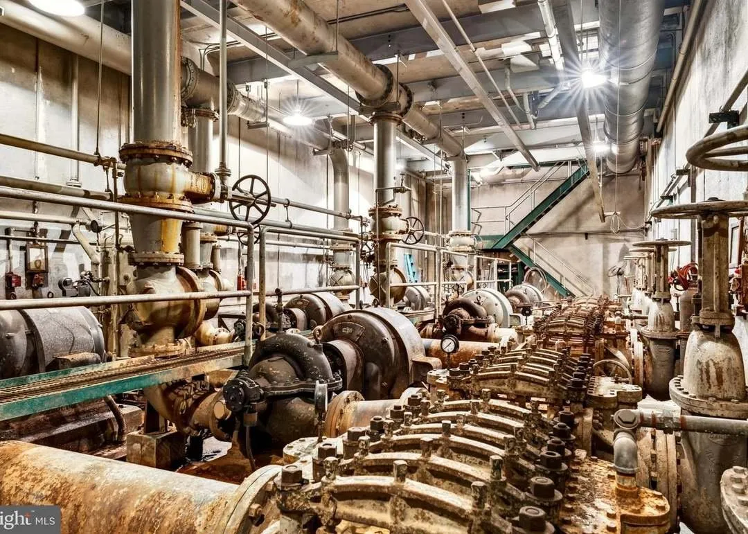A closer view of the original water pumps and piping in the mechanical level