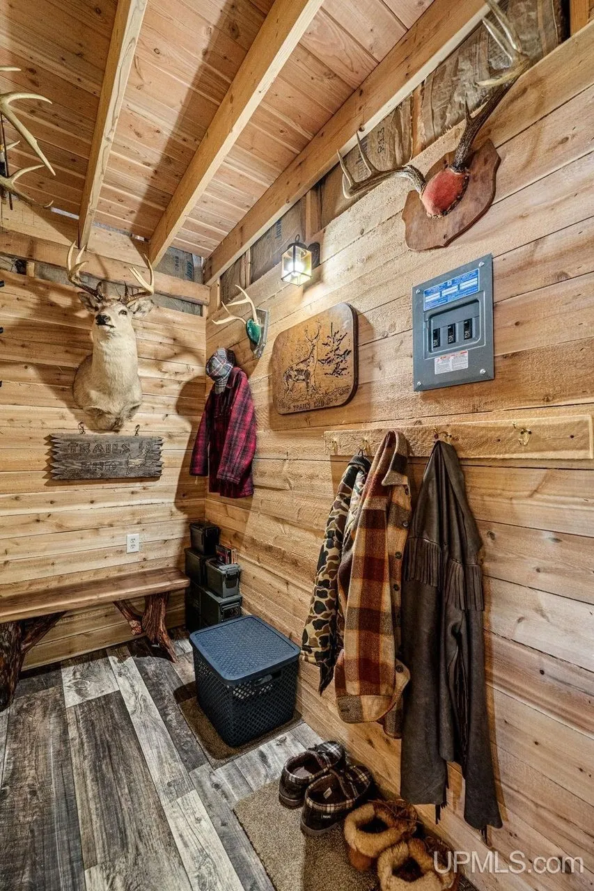 Coats hanging by the door inside the entry