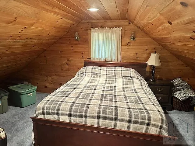 The loft bed by the window under the roof