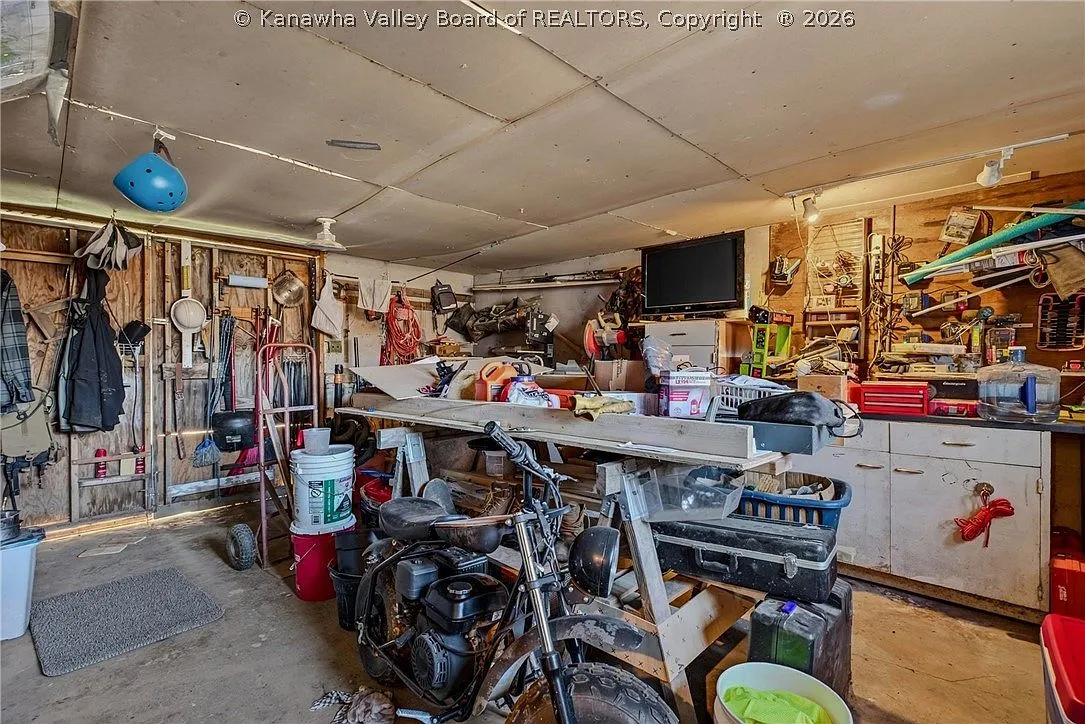 The detached garage and workshop interior, cluttered with tools and equipment