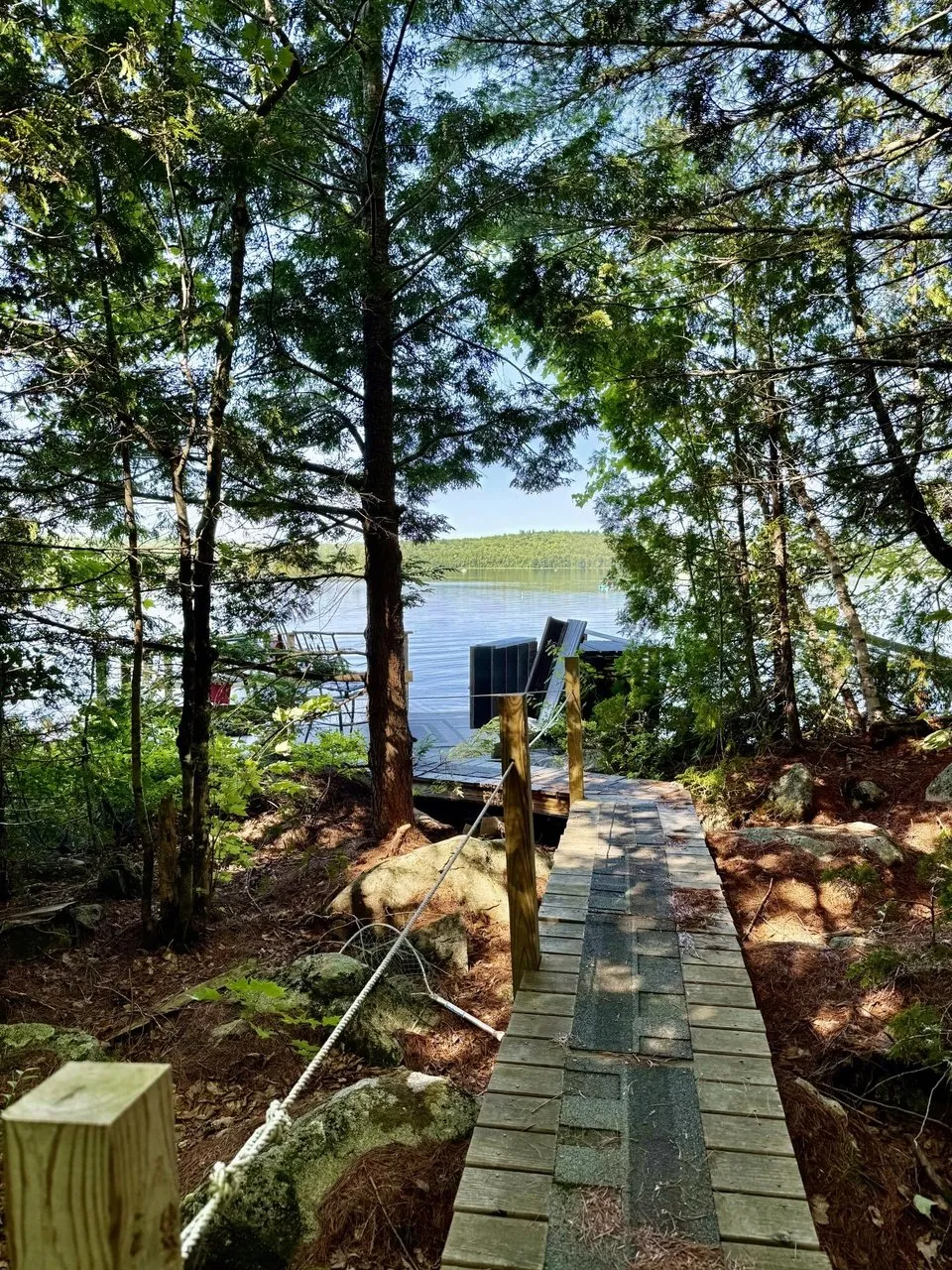 The path down to the water with the pond through the trees