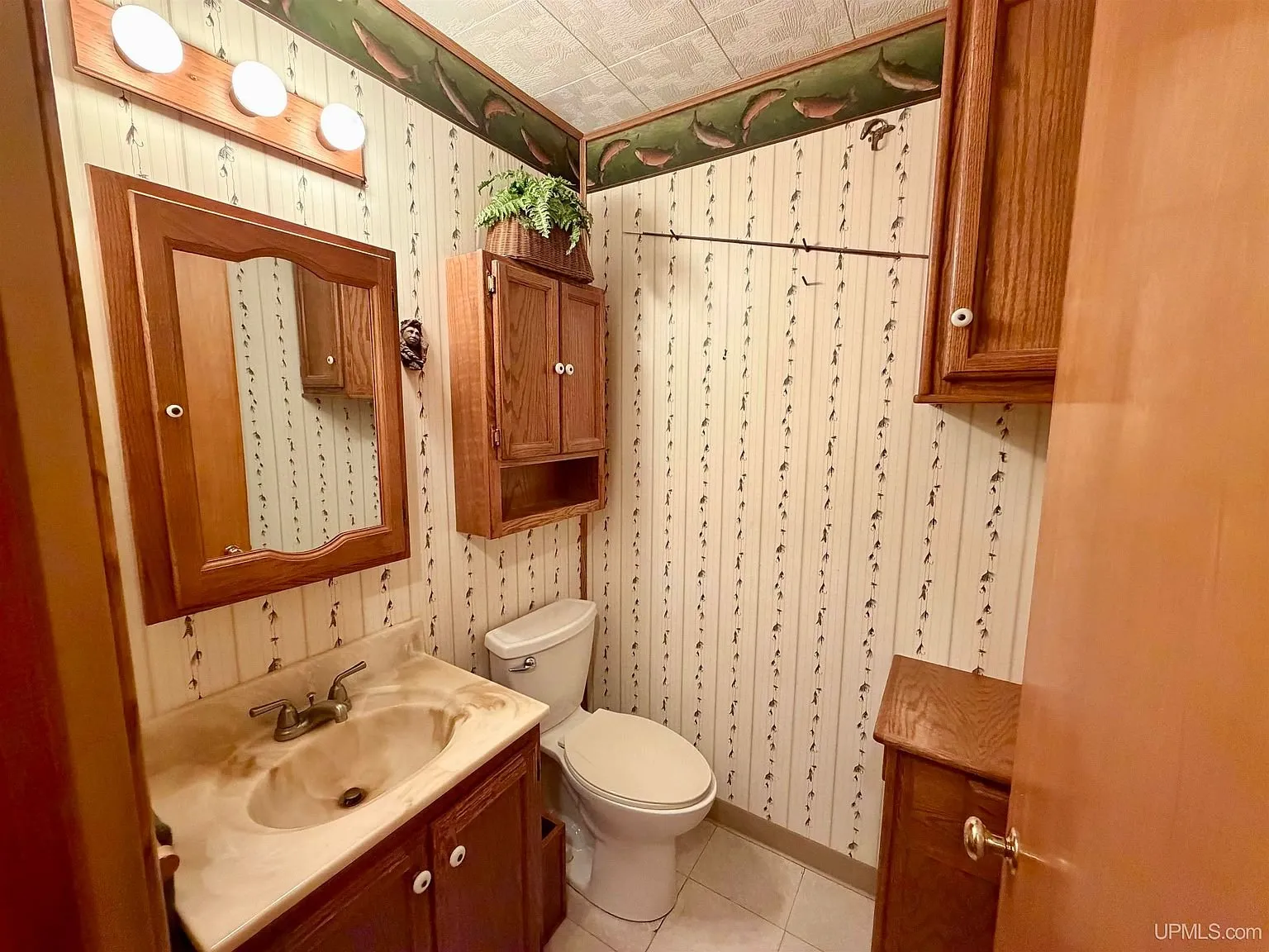 The half bath with the vanity and toilet