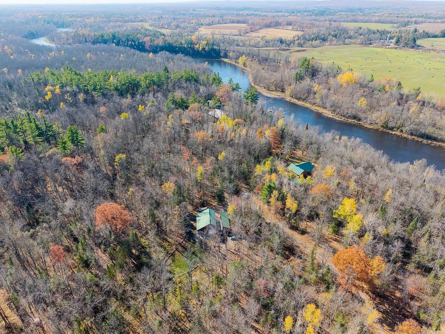 Aerial view of the home and a second cabin near the Chippewa River