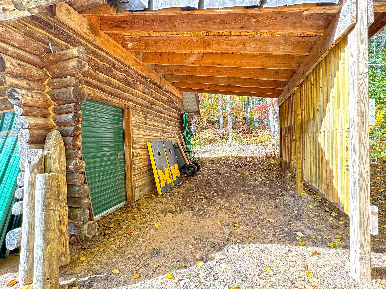 Inside the open-fronted garage bay, equipment stored along the walls