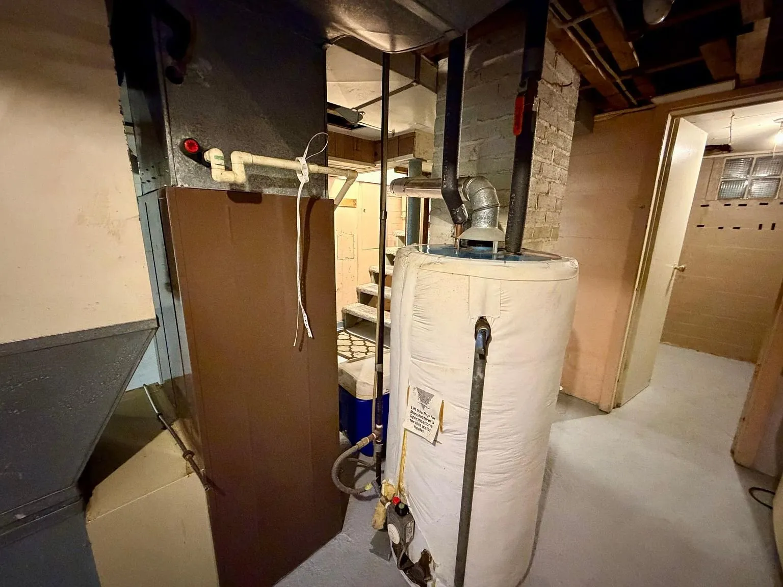 The water heater and the ductwork in the basement