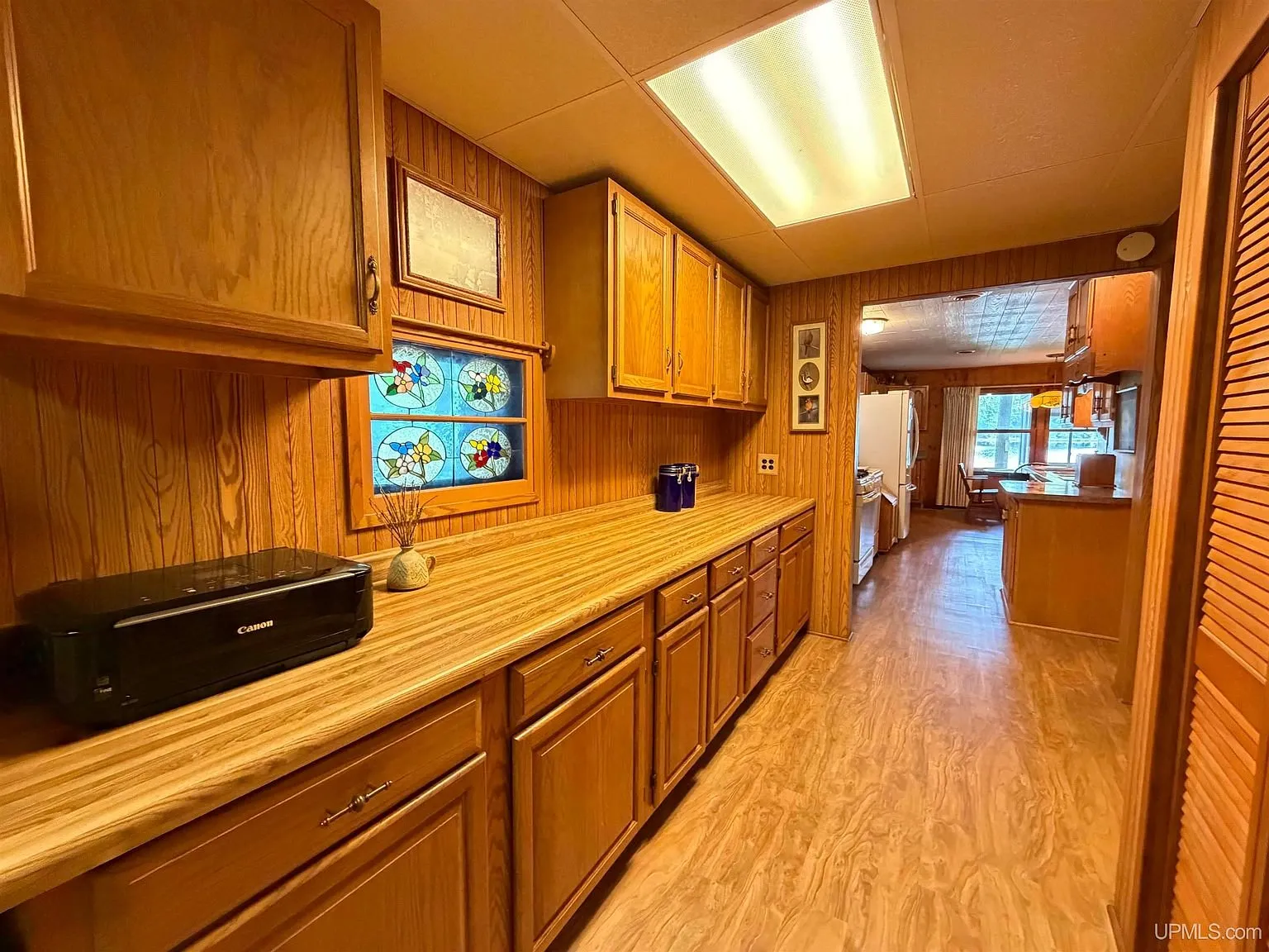 The workshop room with cabinets and a long counter
