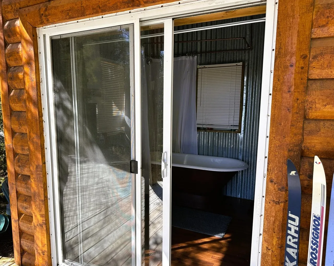 The bathhouse entry with its sliding glass door