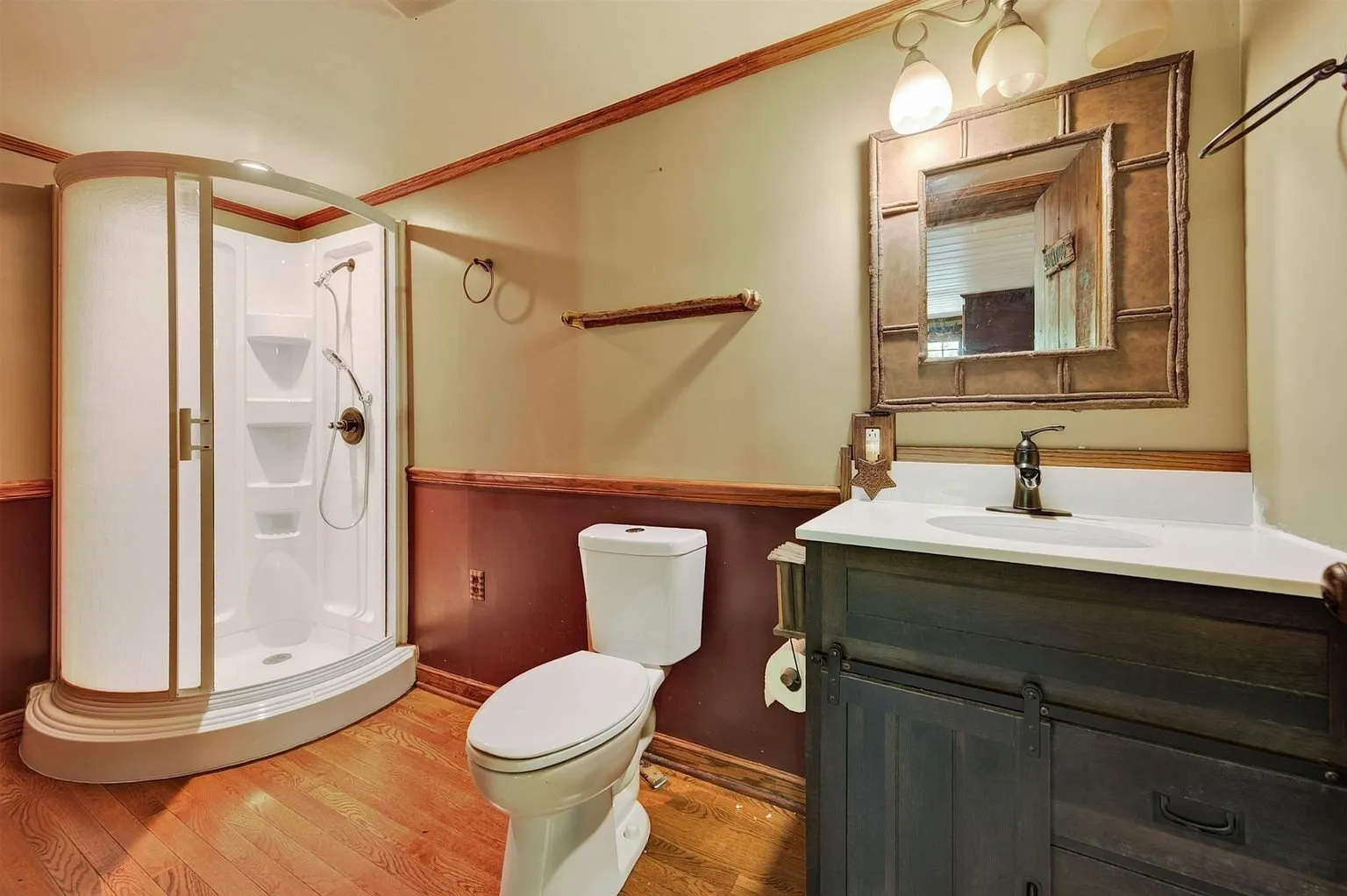 The bathroom with vanity, toilet and shower