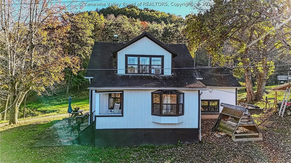 An aerial view of the house's upper dormer and back porch addition