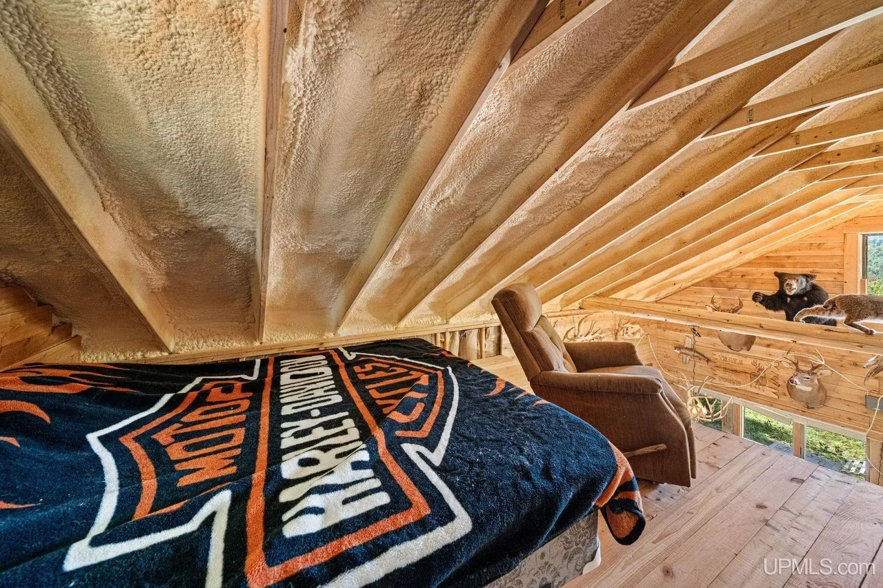 The second bed in the loft beneath the rafters