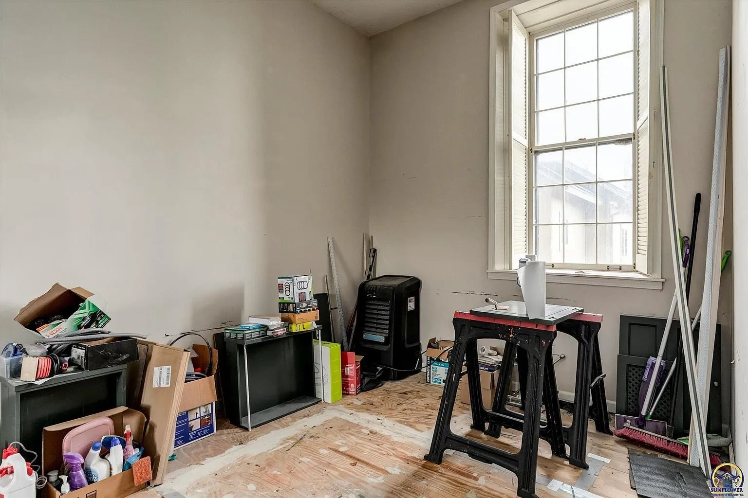 A room in progress with a window and a work table