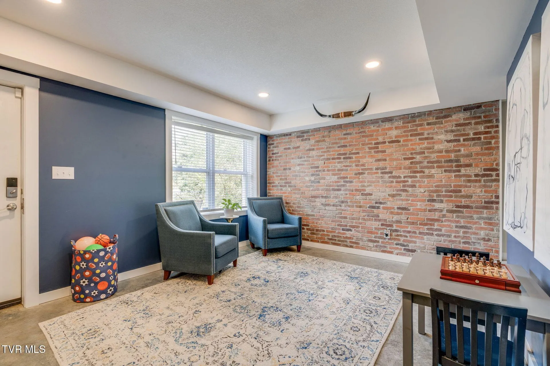 The basement room looking toward the window wall and the seating