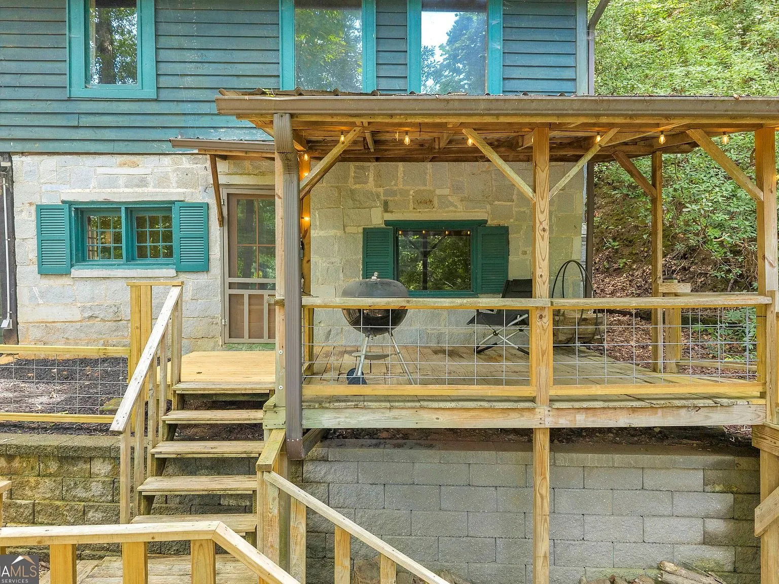 The cabin's exterior with its stacked decks and screened porch levels