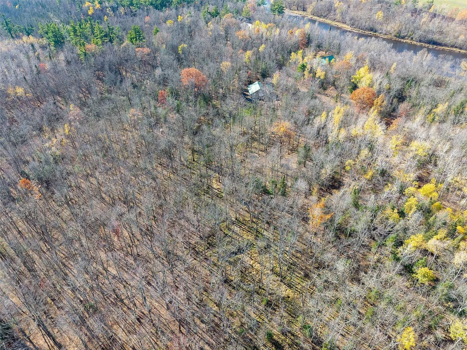 Aerial view of the home with the Chippewa River visible in the distance