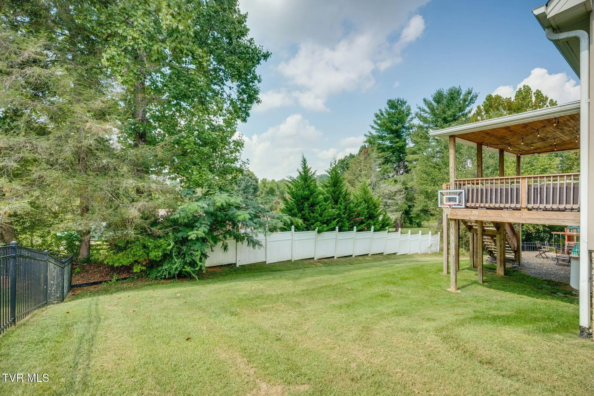 The back yard from the rear fence looking toward the house
