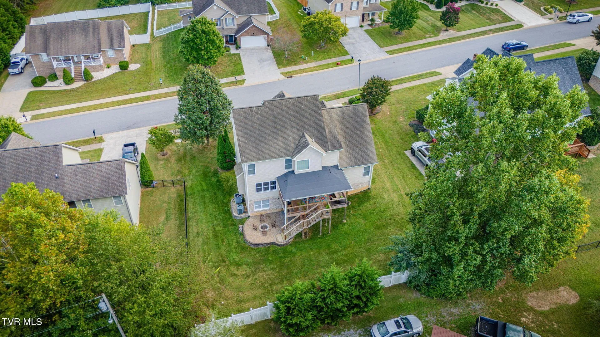 The neighborhood from the air with the house among the trees