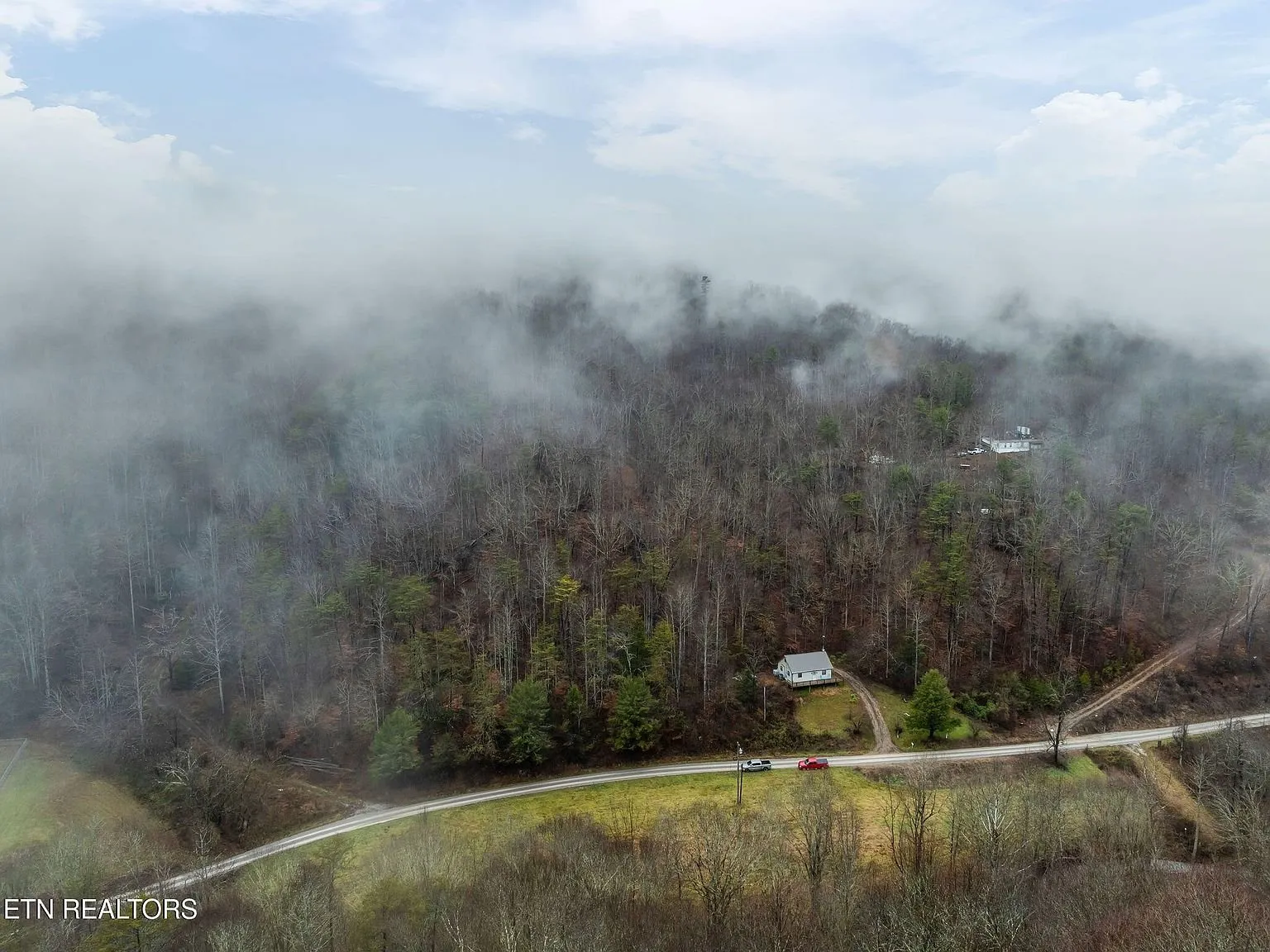 Aerial view of the surrounding mountain ridgelines in heavy fog