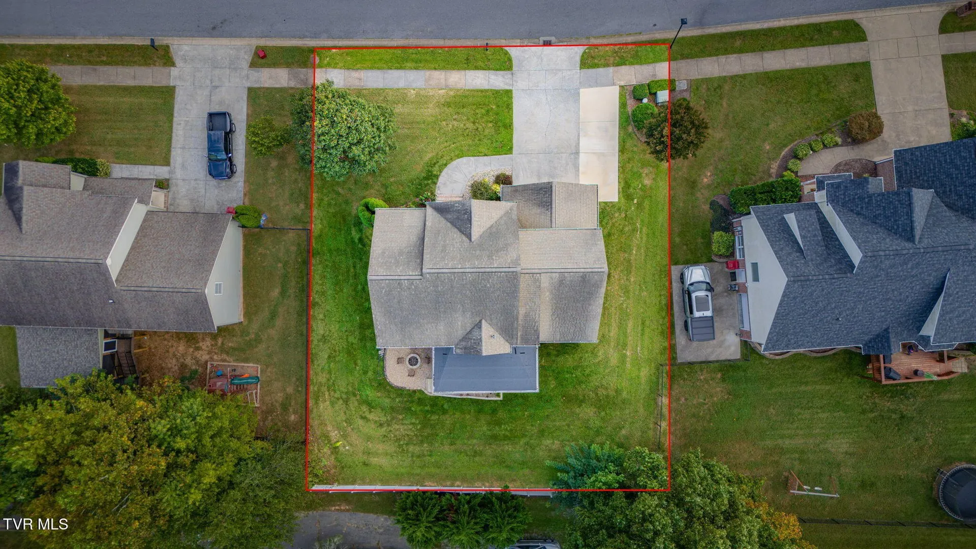 The house and its lot from above with the fenced rear yard