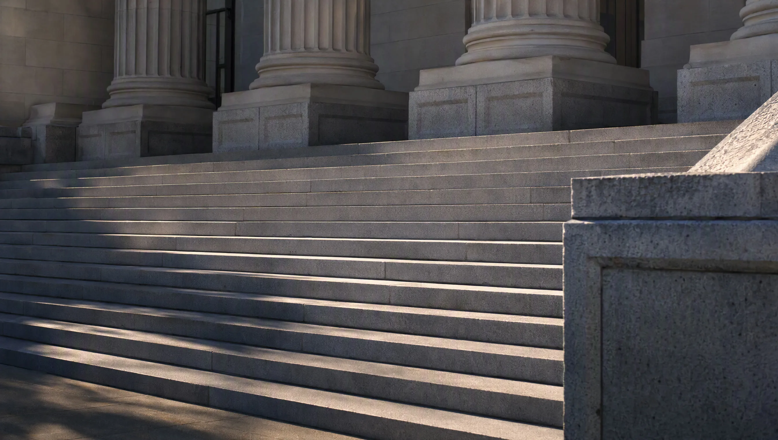 The steps of a county courthouse on a bright morning
