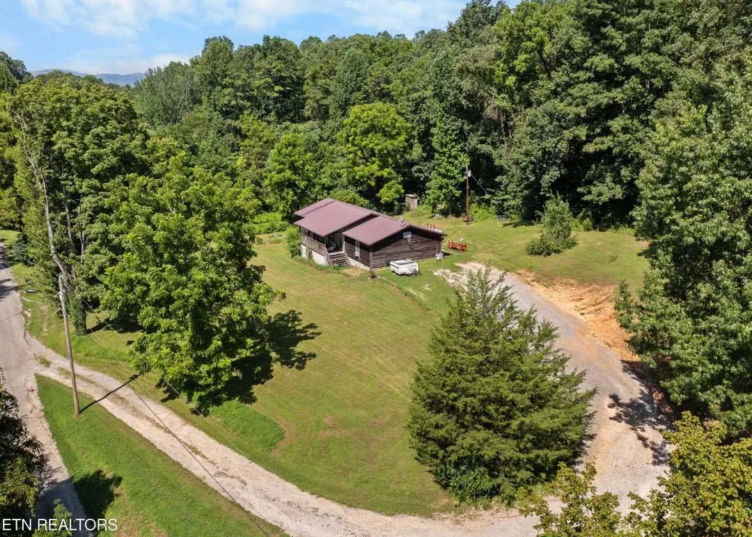 Aerial view of the property and the surrounding mountain ridgelines