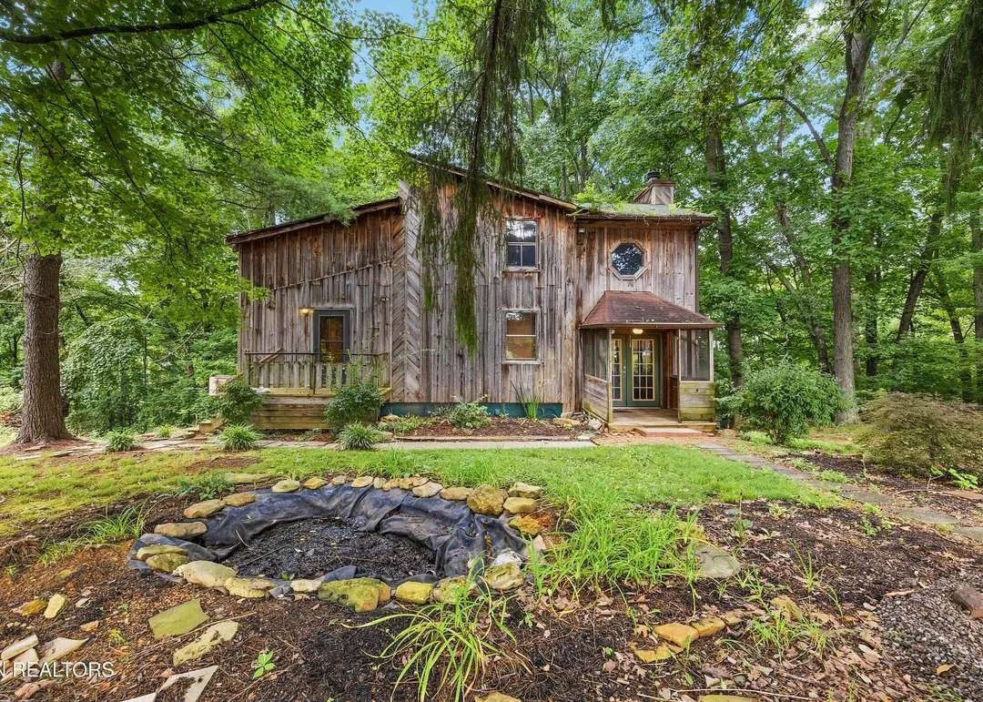 A hand-built wood cabin with a vaulted loft, tucked into the trees outside Knoxville, Tennessee