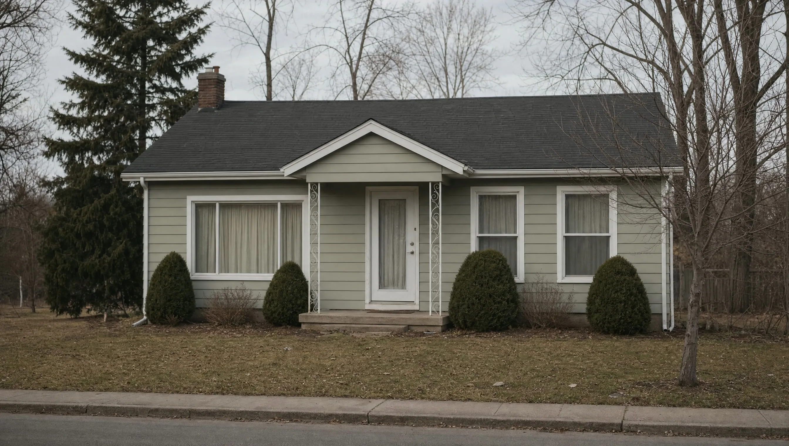 An empty house with curtains drawn in plain daylight