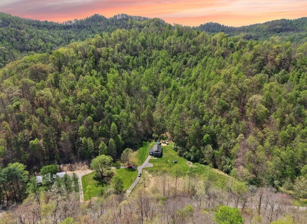 Aerial over the wooded ridges at dusk