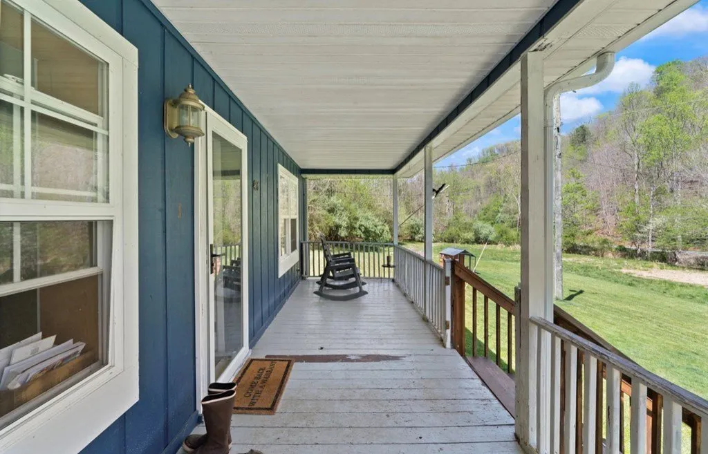 The covered front porch looking out over the yard