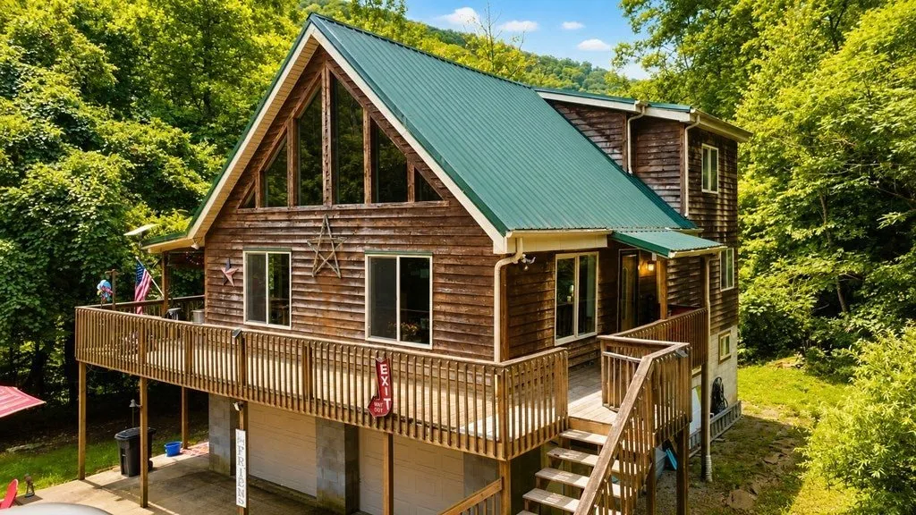 The A-frame from the driveway, the deck stairs on the right