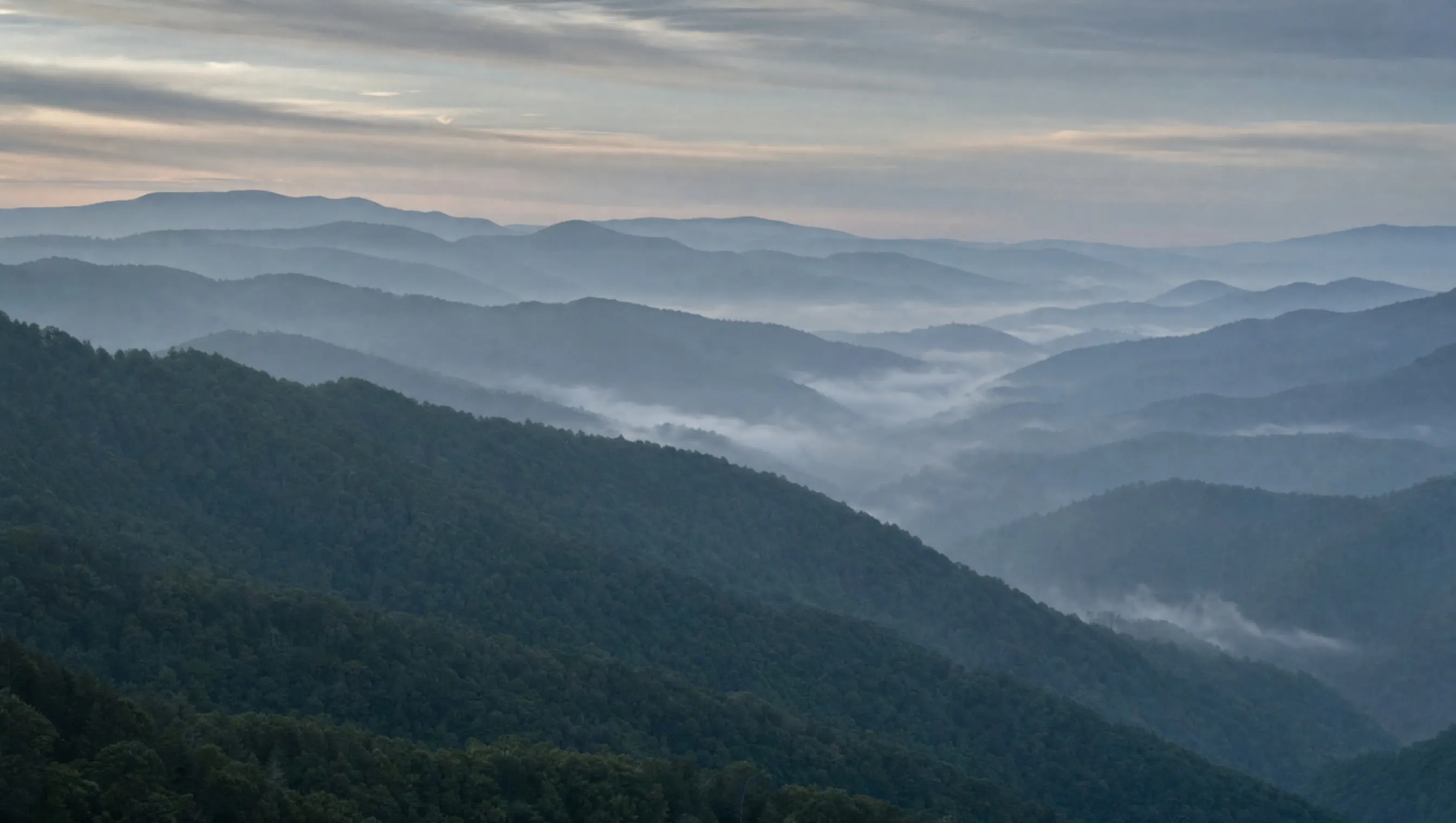 Appalachian ridgelines receding in layered morning haze