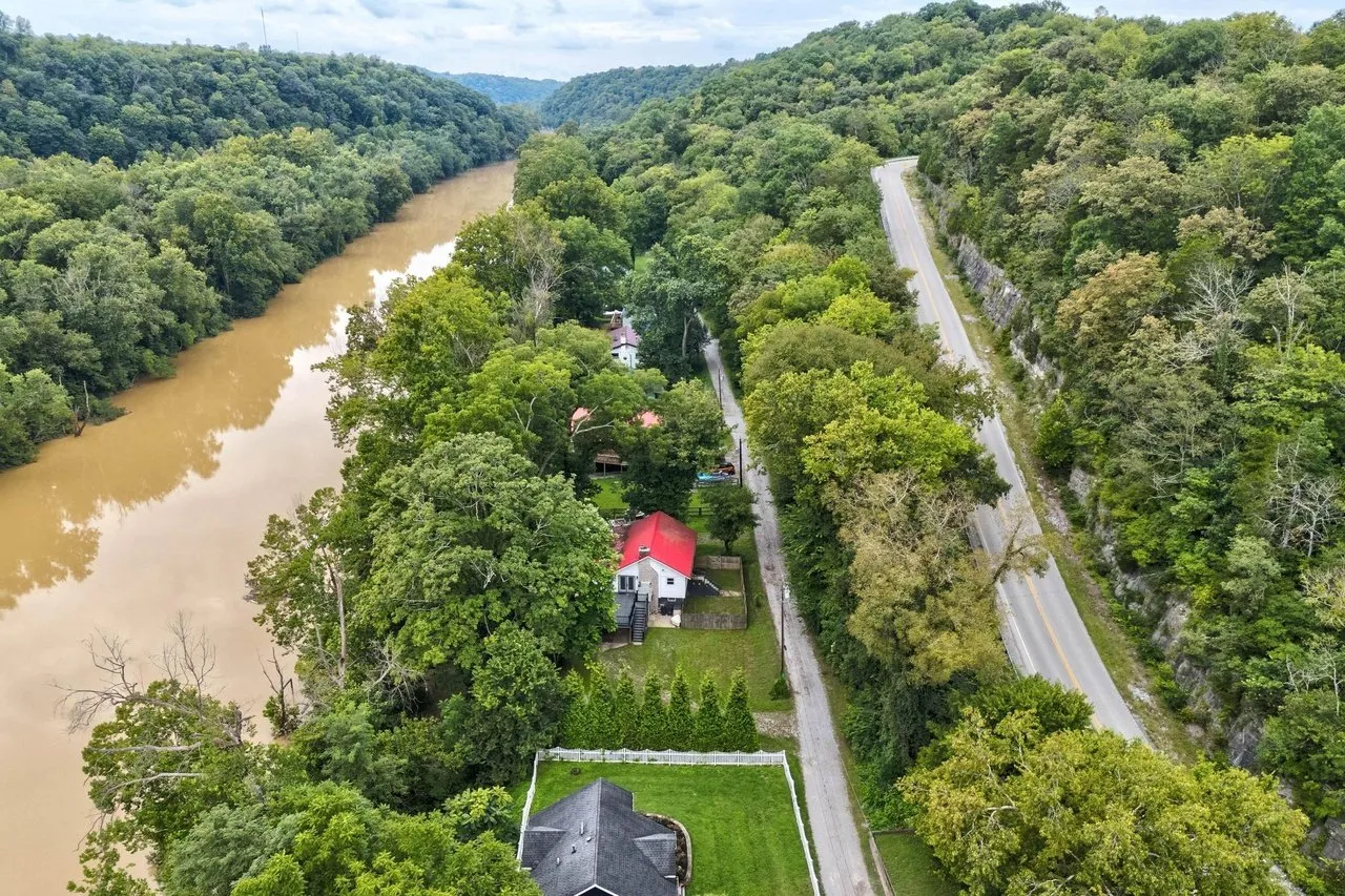 Aerial of the house and the road with the river curving past
