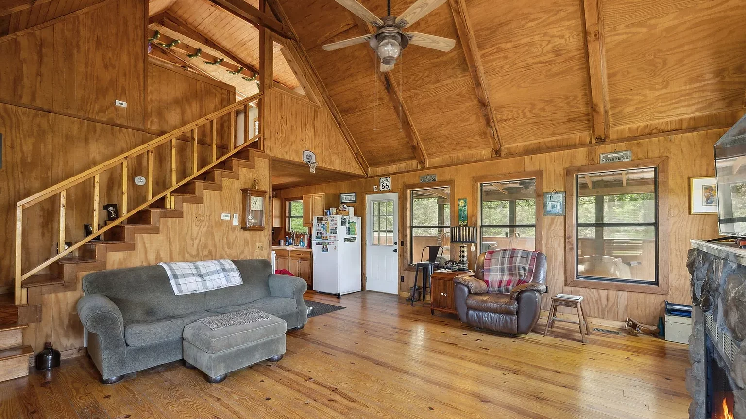 Log cabin for sale at 2385 W Leatherwood Rd, Cumberland Furnace, TN. 2 bd, 1 ba on 6 acres w/ creek access, vaulted ceilings, no HOA—near Nashville.