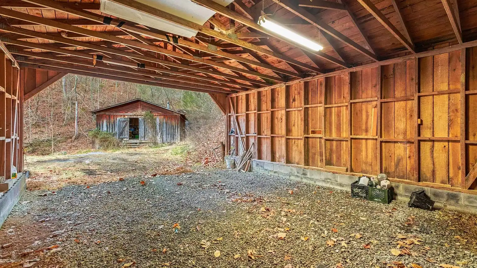 Log Cabin for Sale in Cosby Tennessee on 50 Acres with Pond, Cabins, and Mountain Views 3099 Mica Way, Cosby, TN 37722 Scottie Hooper realtor Cosby Tennessee