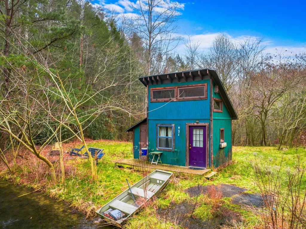 Log Cabin for Sale in Cosby Tennessee on 50 Acres with Pond, Cabins, and Mountain Views 3099 Mica Way, Cosby, TN 37722 Scottie Hooper realtor Cosby Tennessee