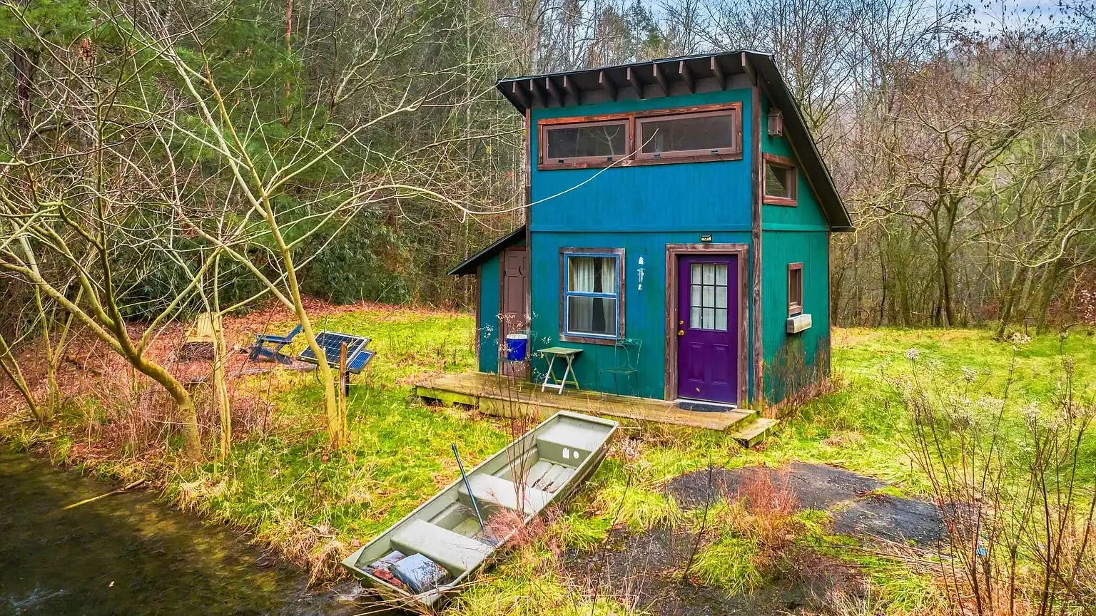 Log Cabin for Sale in Cosby Tennessee on 50 Acres with Pond, Cabins, and Mountain Views 3099 Mica Way, Cosby, TN 37722 Scottie Hooper realtor Cosby Tennessee