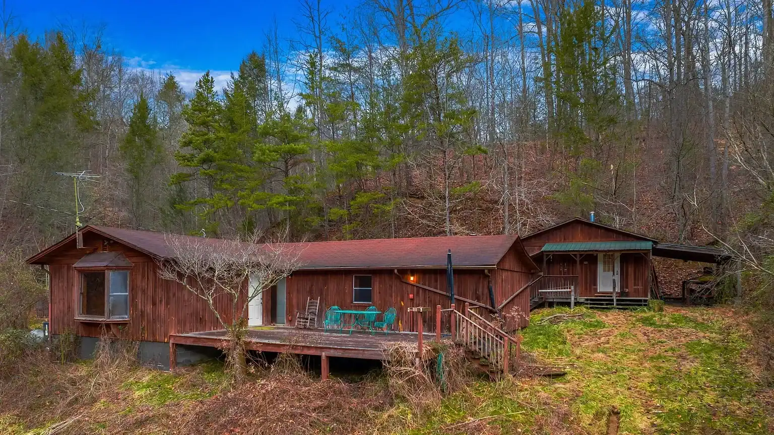 Log Cabin for Sale in Cosby Tennessee on 50 Acres with Pond, Cabins, and Mountain Views 3099 Mica Way, Cosby, TN 37722 Scottie Hooper realtor Cosby Tennessee