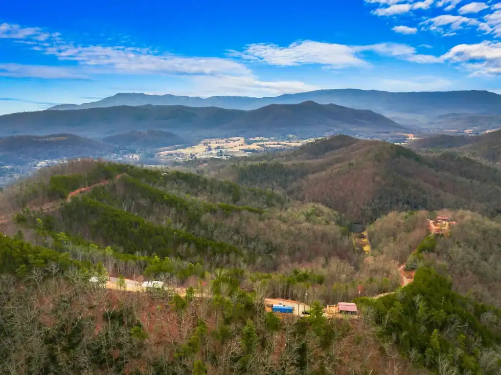 Log Cabin for Sale in Cosby Tennessee on 50 Acres with Pond, Cabins, and Mountain Views 3099 Mica Way, Cosby, TN 37722 Scottie Hooper realtor Cosby Tennessee