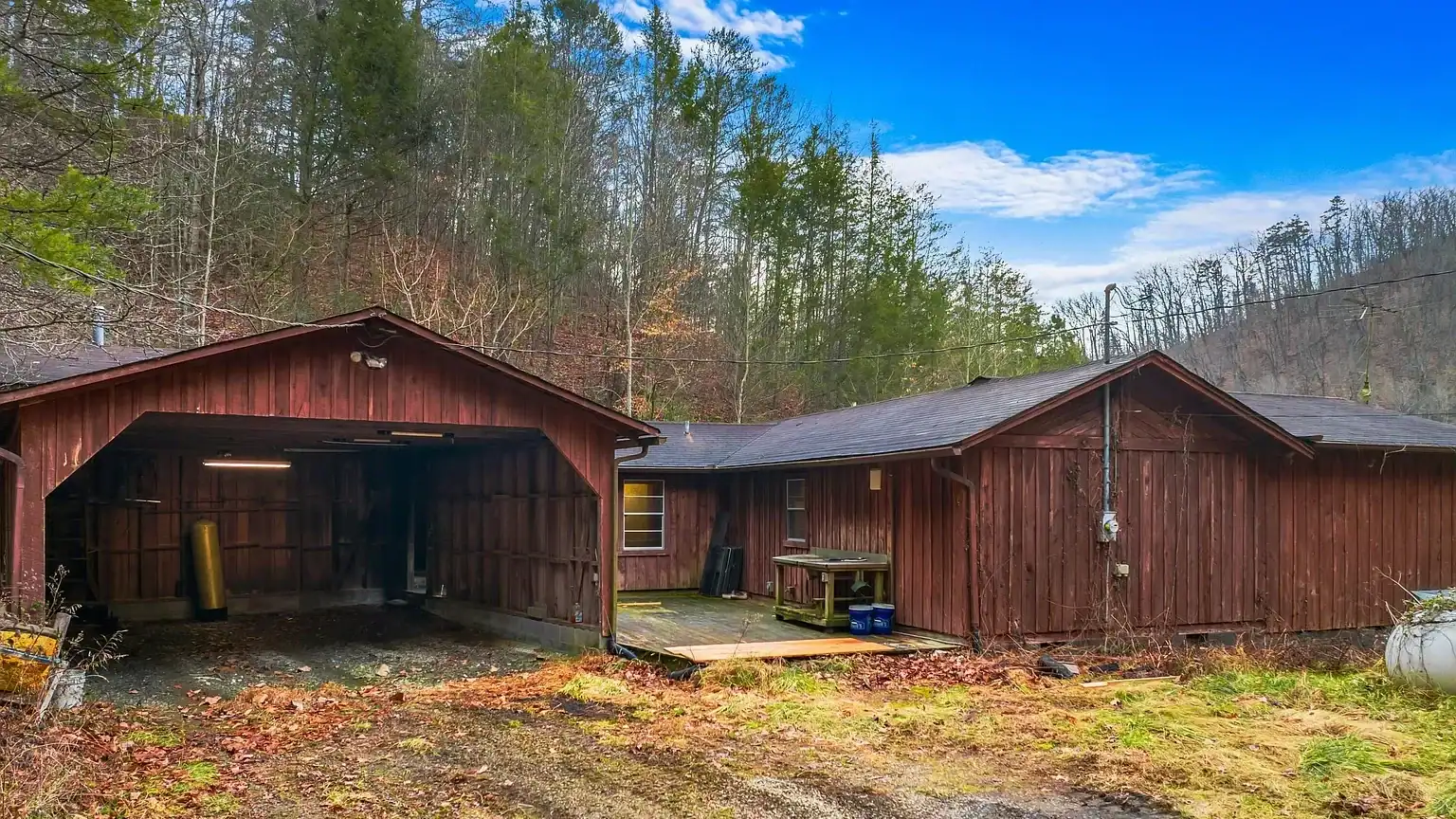 Log Cabin for Sale in Cosby Tennessee on 50 Acres with Pond, Cabins, and Mountain Views 3099 Mica Way, Cosby, TN 37722 Scottie Hooper realtor Cosby Tennessee
